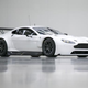 Illustration for article titled An Aston Martin With A Dinner Table Hanging Under Its Rear End Means Business